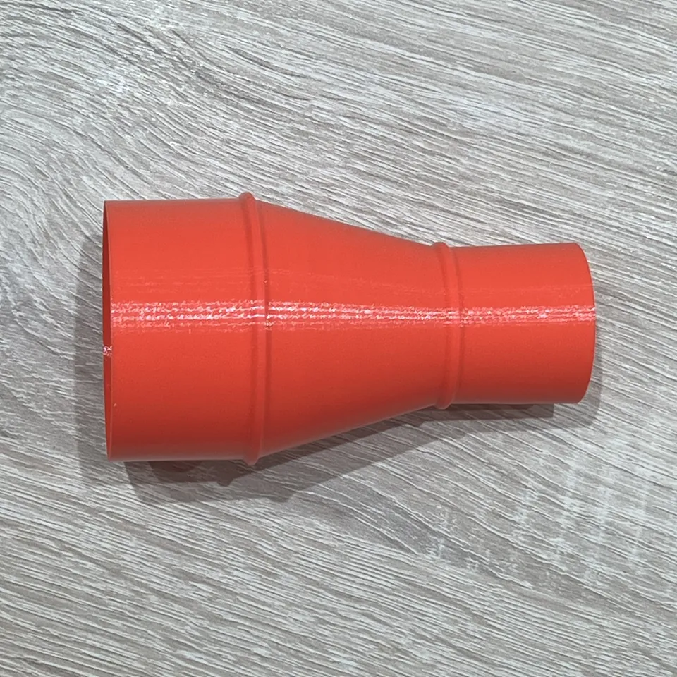 Dust collection adapter - Red adapter side profile with tapered body and raised collars